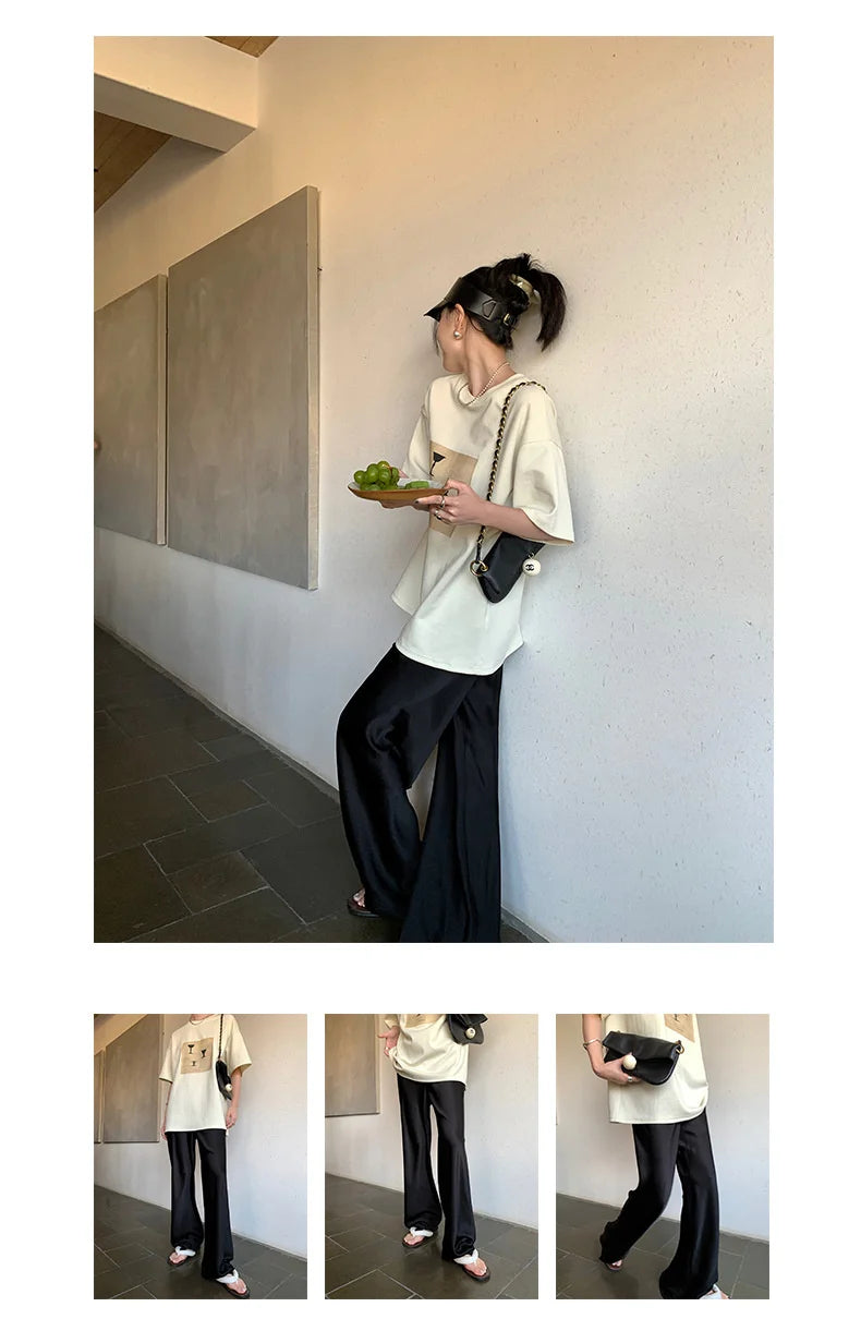 Calça feminina longa e ampla de cetim, estilo casual, ideal para o verão.