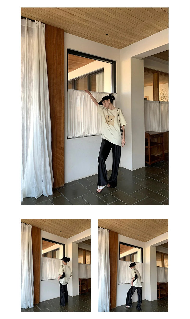 Calça feminina longa e ampla de cetim, estilo casual, ideal para o verão.